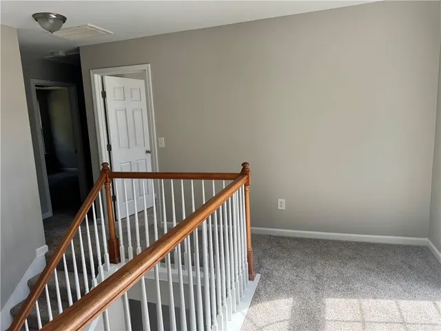 a view of a hallway view with staircase