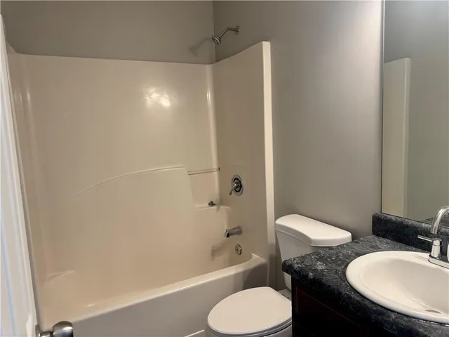 a bathroom with a toilet sink and a bathtub