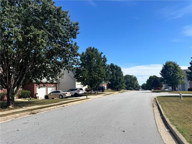 a view of a street with a house
