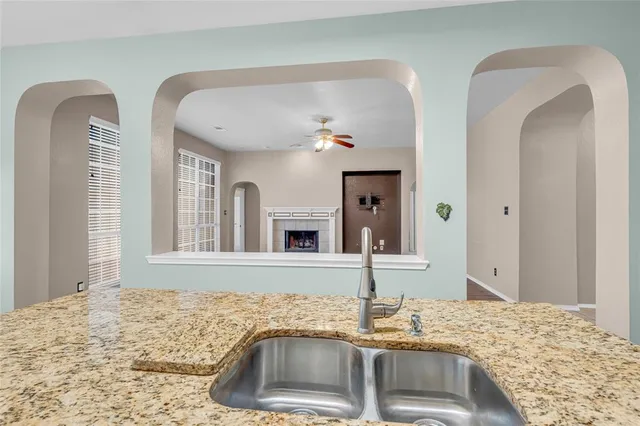 a bathroom with double vanity sink and a bathtub