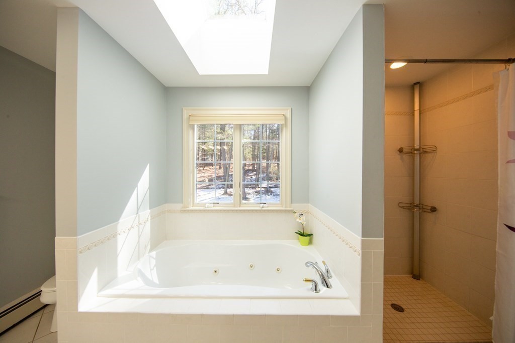 23 Pine Knoll Road Lexington, MA 02420 - Photo 24 of 42 a white bath tub sitting next to a window