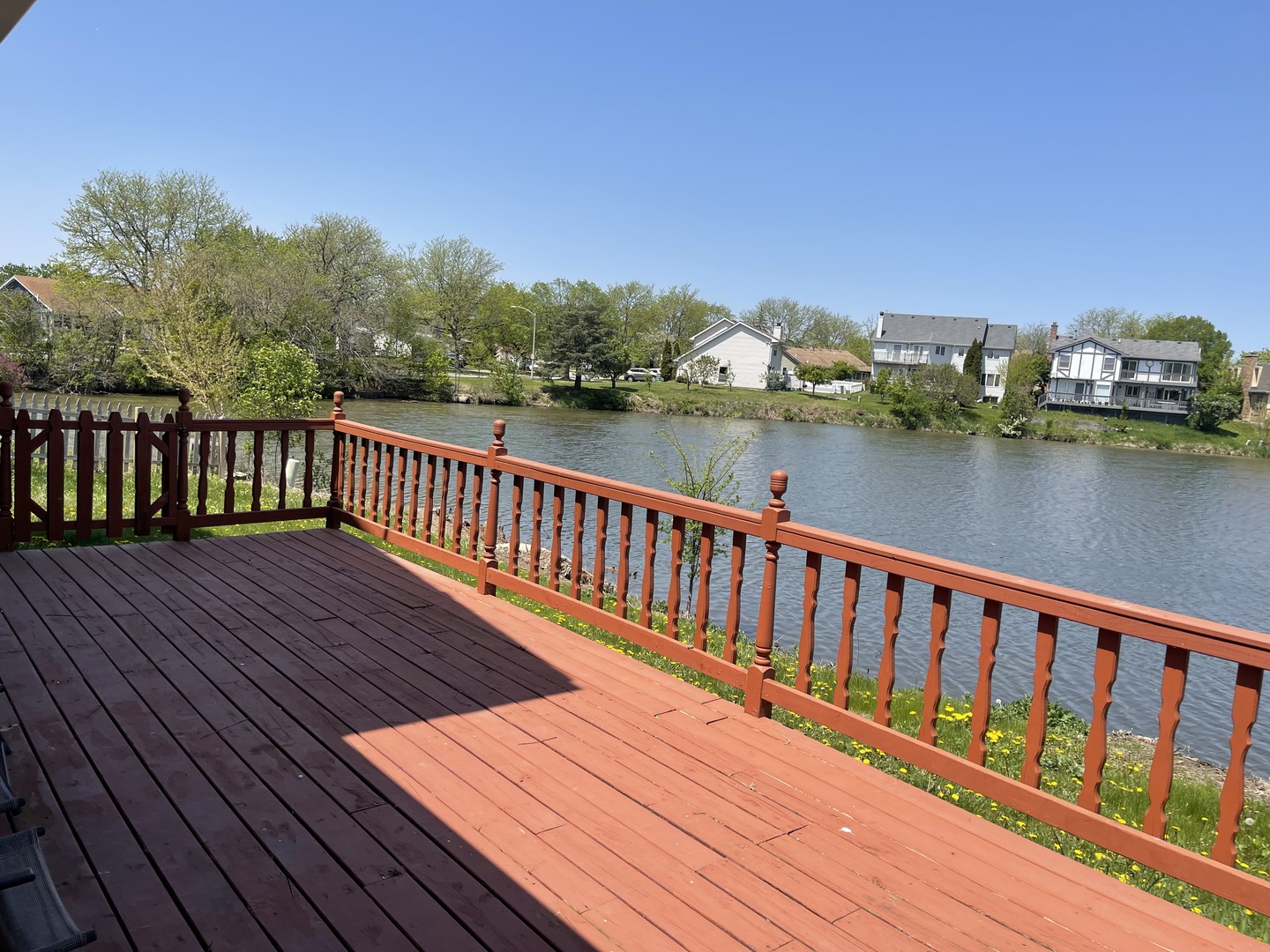 1964 Crescent Lane Hoffman Estates, IL 60169 - Photo 2 of 11 a balcony with wooden floor and lake view