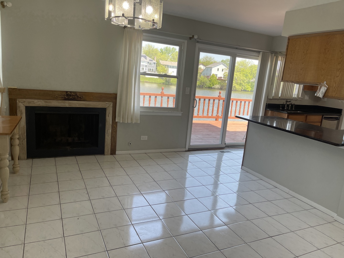 1964 Crescent Lane Hoffman Estates, IL 60169 - Photo 5 of 11 an empty room with windows and fireplace