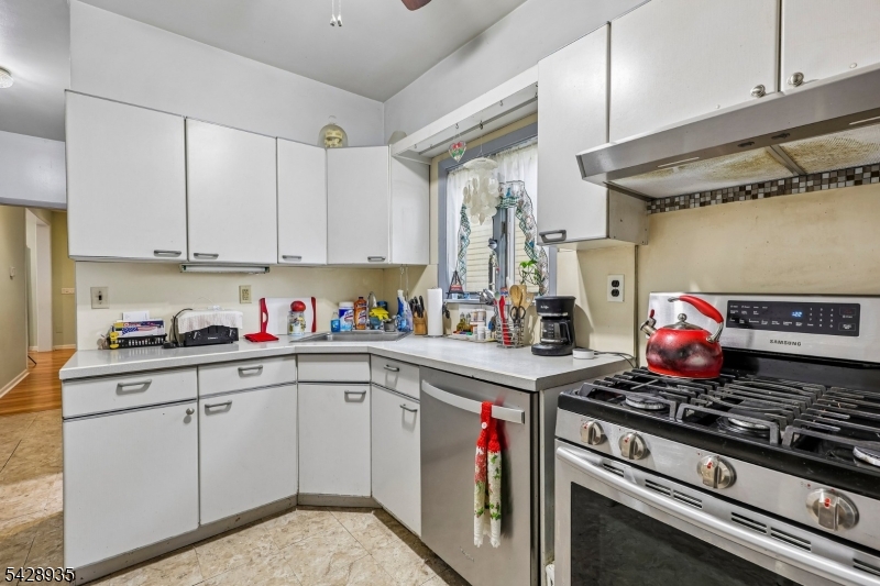 50 Preston Street Ridgefield Park, NJ 07660 - Photo 16 of 41 a kitchen with a stove and a refrigerator