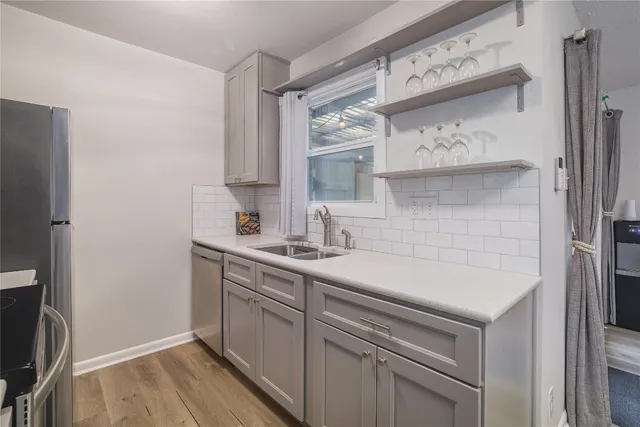 a kitchen with a table chairs microwave and stove