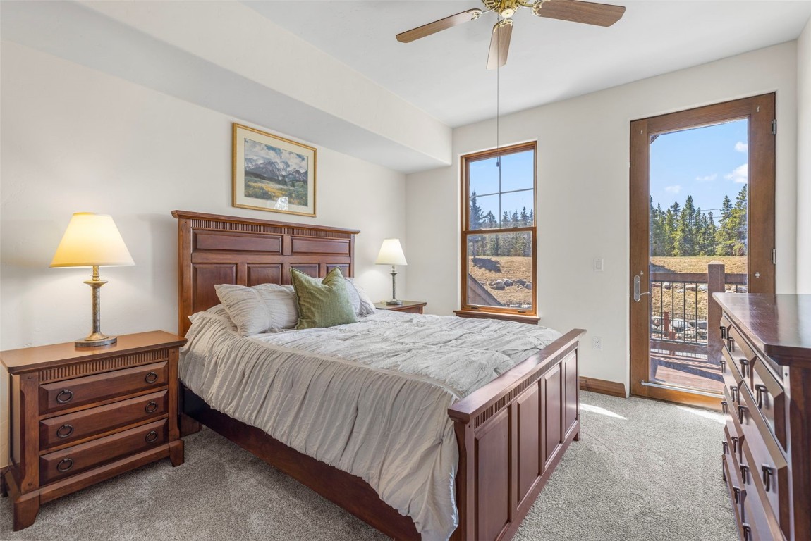 34 Highfield Trail, Unit 209 Breckenridge, CO 80424 - Photo 12 of 24 a bedroom with a bed and a table in it