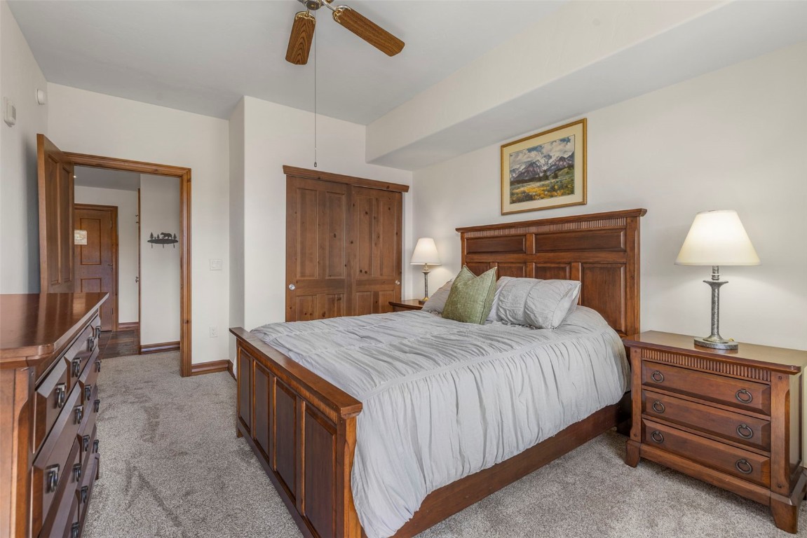 34 Highfield Trail, Unit 209 Breckenridge, CO 80424 - Photo 13 of 24 a bedroom with a bed and a dresser