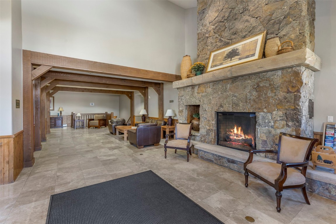 34 Highfield Trail, Unit 209 Breckenridge, CO 80424 - Photo 21 of 24 a living room with furniture and a fireplace