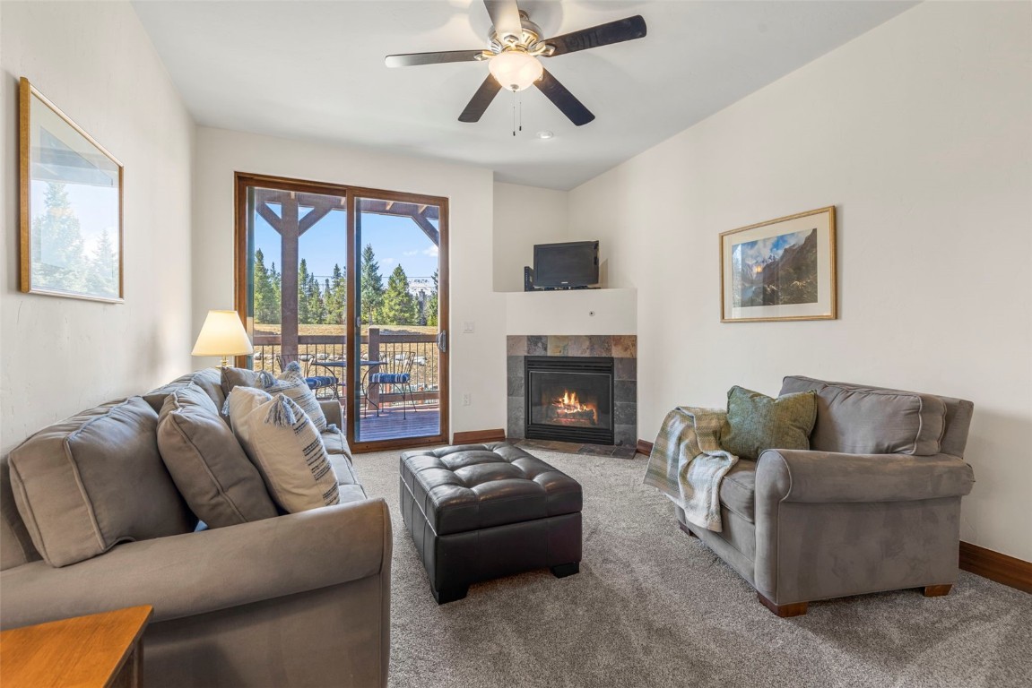 34 Highfield Trail, Unit 209 Breckenridge, CO 80424 - Photo 4 of 24 a living room with furniture and a fireplace