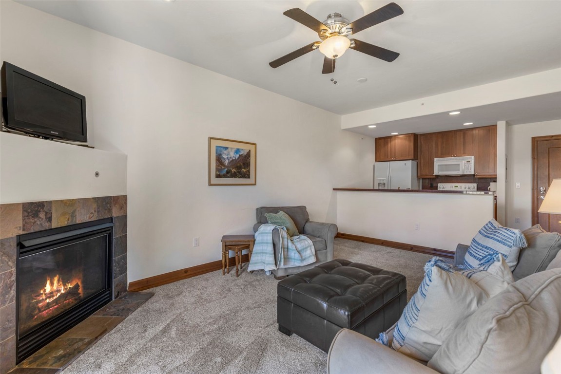 34 Highfield Trail, Unit 209 Breckenridge, CO 80424 - Photo 8 of 24 a living room with furniture and a fireplace
