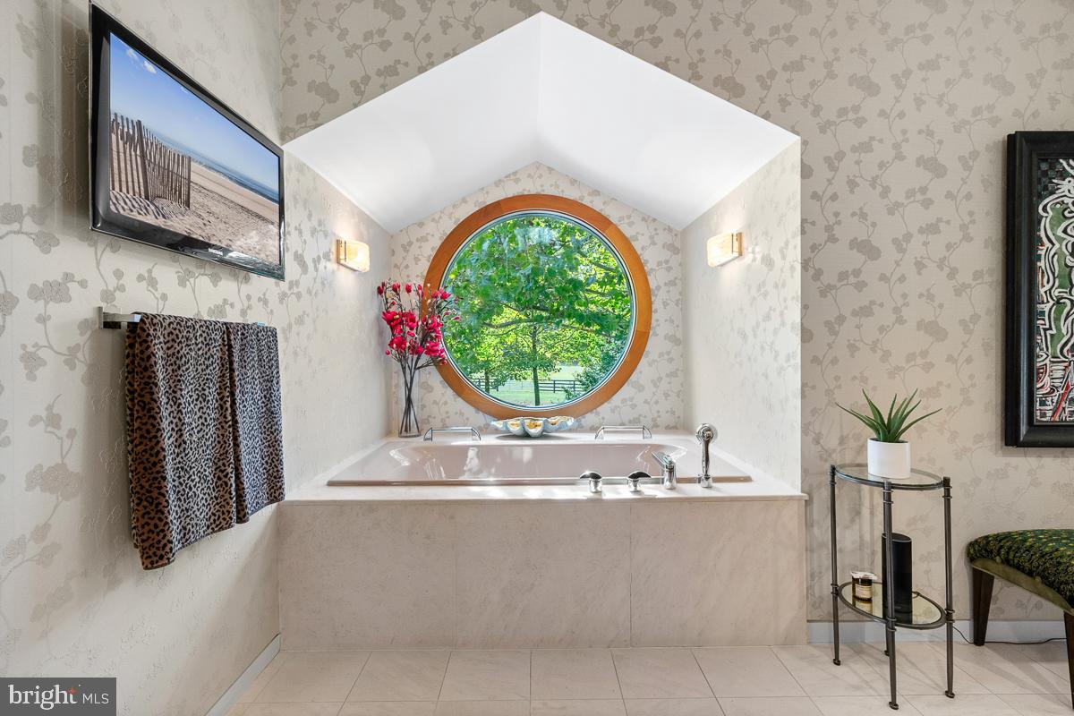 27772 Sharp Road Easton, MD 21601 - Photo 25 of 85 a view of a kitchen with a sink and a fireplace