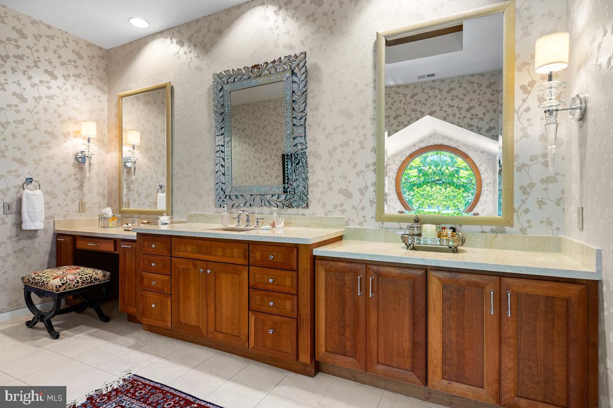 27772 Sharp Road Easton, MD 21601 - Photo 27 of 85 a bathroom with a double vanity sink and a mirror