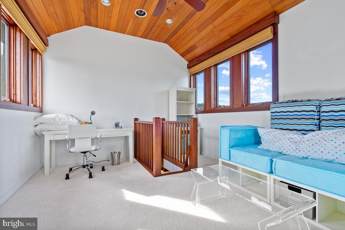27772 Sharp Road Easton, MD 21601 - Photo 32 of 85 a dining room with furniture and a chandelier
