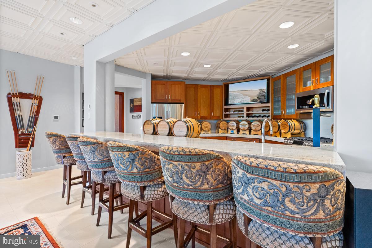 27772 Sharp Road Easton, MD 21601 - Photo 42 of 85 a dining room with furniture and a chandelier