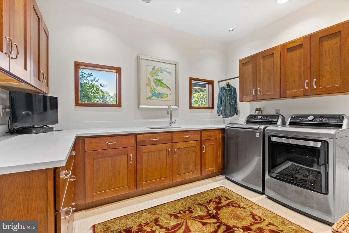 27772 Sharp Road Easton, MD 21601 - Photo 45 of 85 a kitchen with stainless steel appliances granite countertop a stove a sink and a microwave
