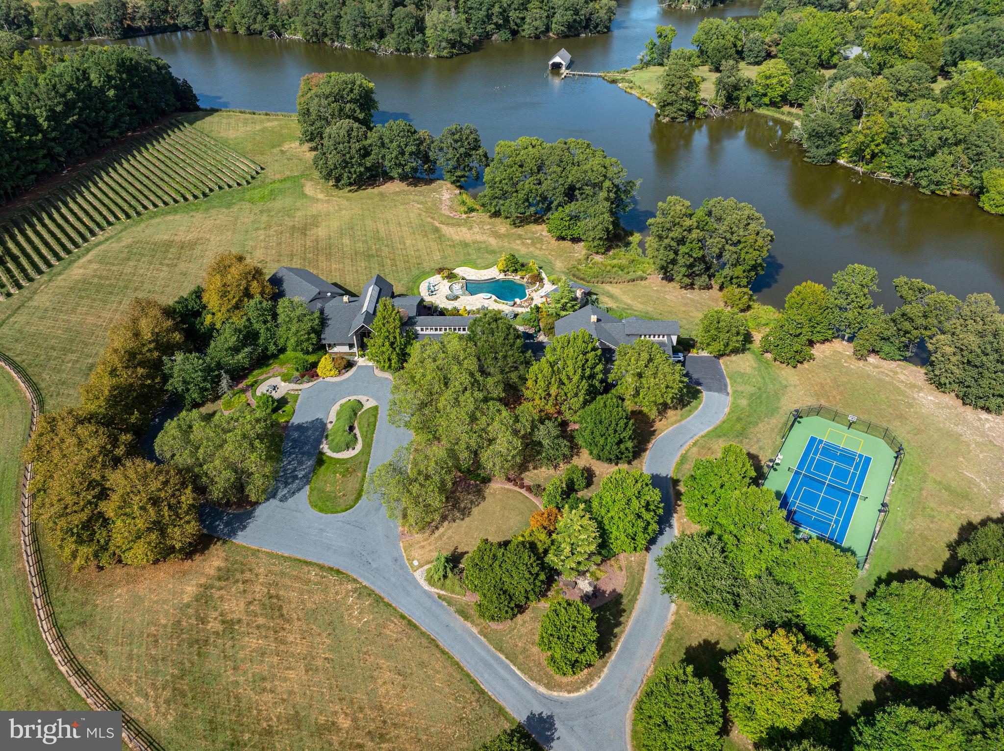 27772 Sharp Road Easton, MD 21601 - Photo 85 of 85 an aerial view of a house with a yard and lake view