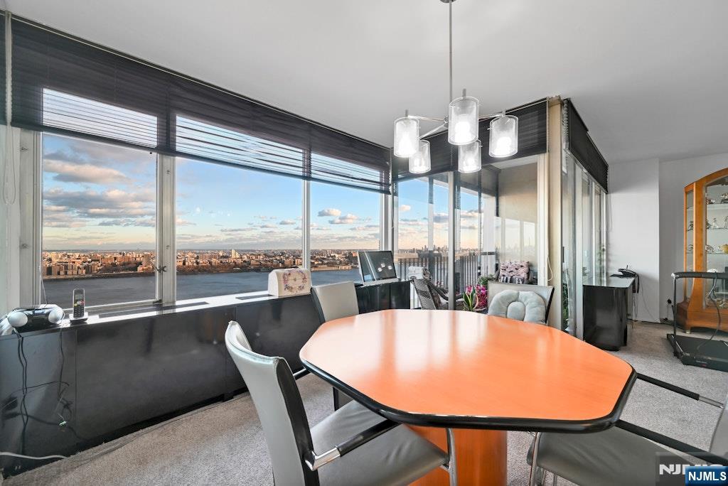 5 Horizon Road, Unit 2909 Fort Lee, NJ 07024 - Photo 11 of 29 a view of a dining room with furniture window and outside view