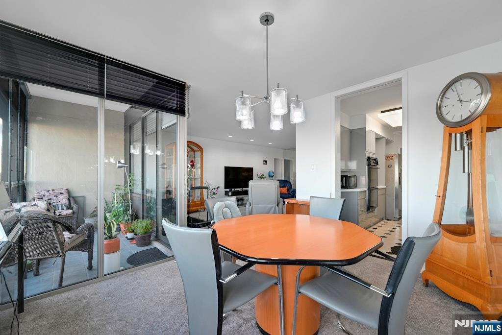 5 Horizon Road, Unit 2909 Fort Lee, NJ 07024 - Photo 12 of 29 a view of a dining room with furniture