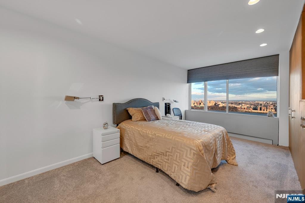 5 Horizon Road, Unit 2909 Fort Lee, NJ 07024 - Photo 14 of 29 a bedroom with a bed and window