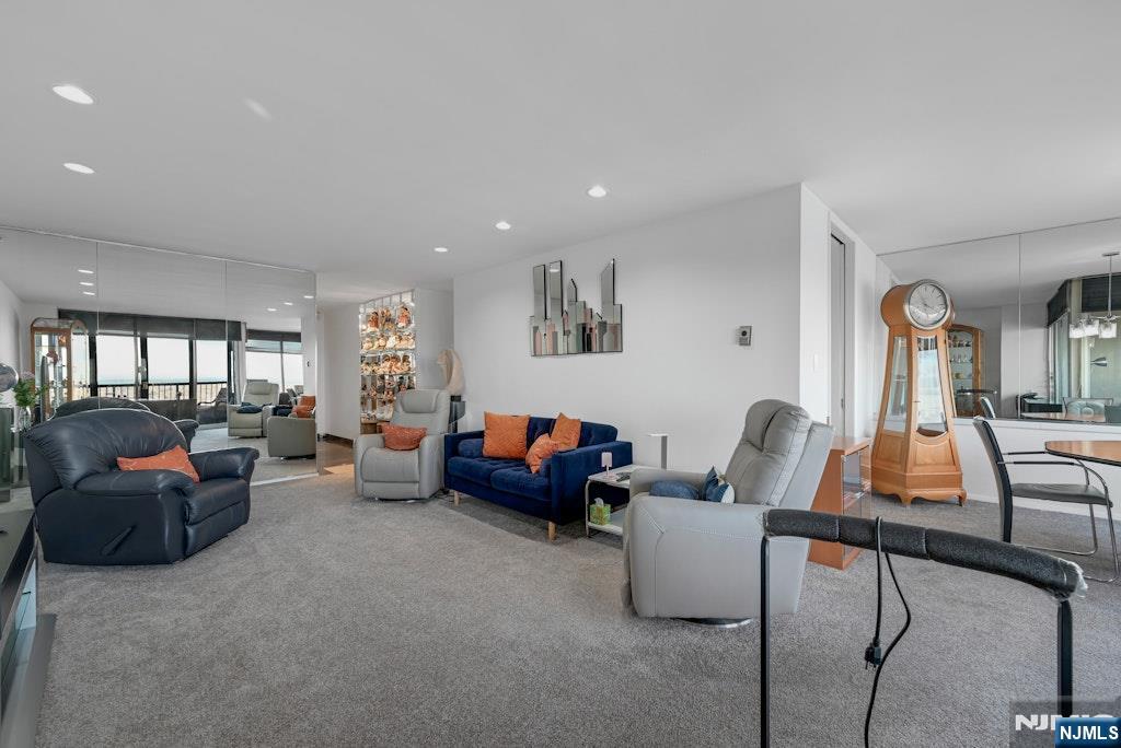 5 Horizon Road, Unit 2909 Fort Lee, NJ 07024 - Photo 7 of 29 a living room with furniture and a large window