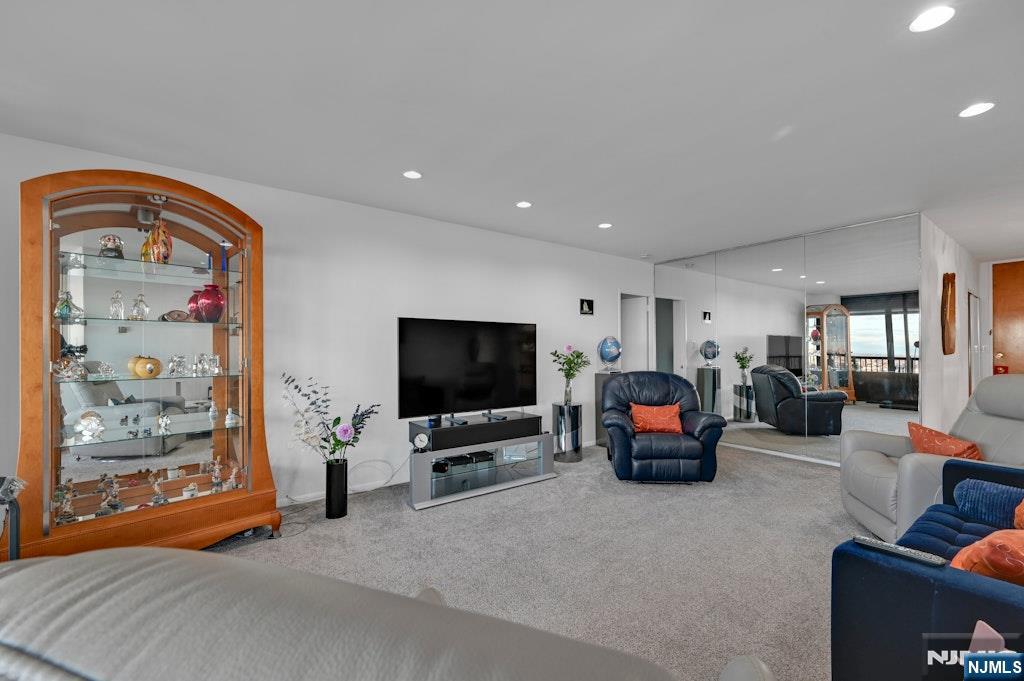 5 Horizon Road, Unit 2909 Fort Lee, NJ 07024 - Photo 8 of 29 a living room with furniture and a flat screen tv