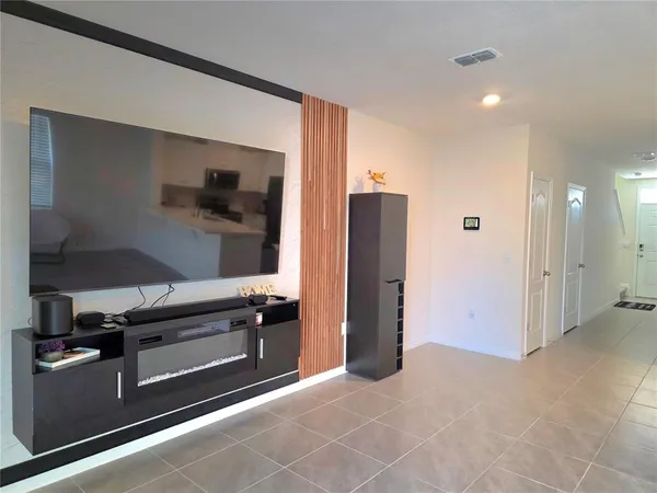 a view of kitchen with stainless steel appliances cabinets