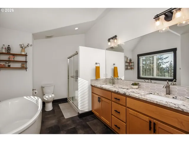 a bathroom with a granite countertop sink mirror and a