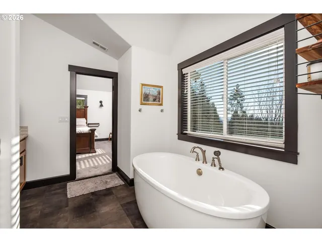 a bathroom with a bathtub and a sink