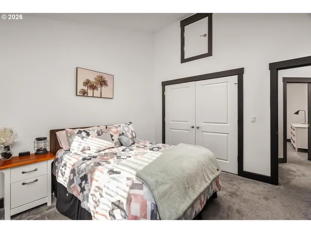 a bedroom with a bed and a cabinets