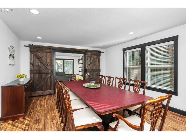 a view of a dining room with furniture and window