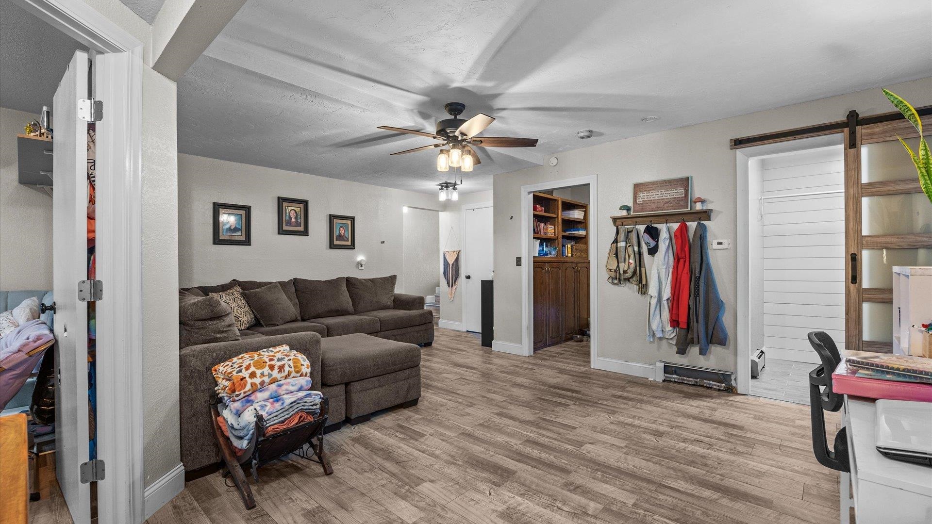 357 Music Lane Grand Junction, CO 81506 - Photo 14 of 29 a living room with furniture a ceiling fan and a window