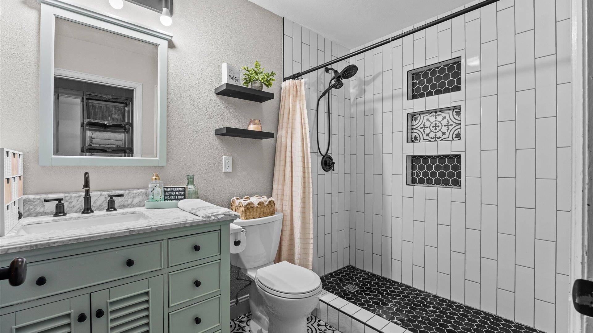 357 Music Lane Grand Junction, CO 81506 - Photo 19 of 29 a bathroom with a granite countertop sink toilet and shower