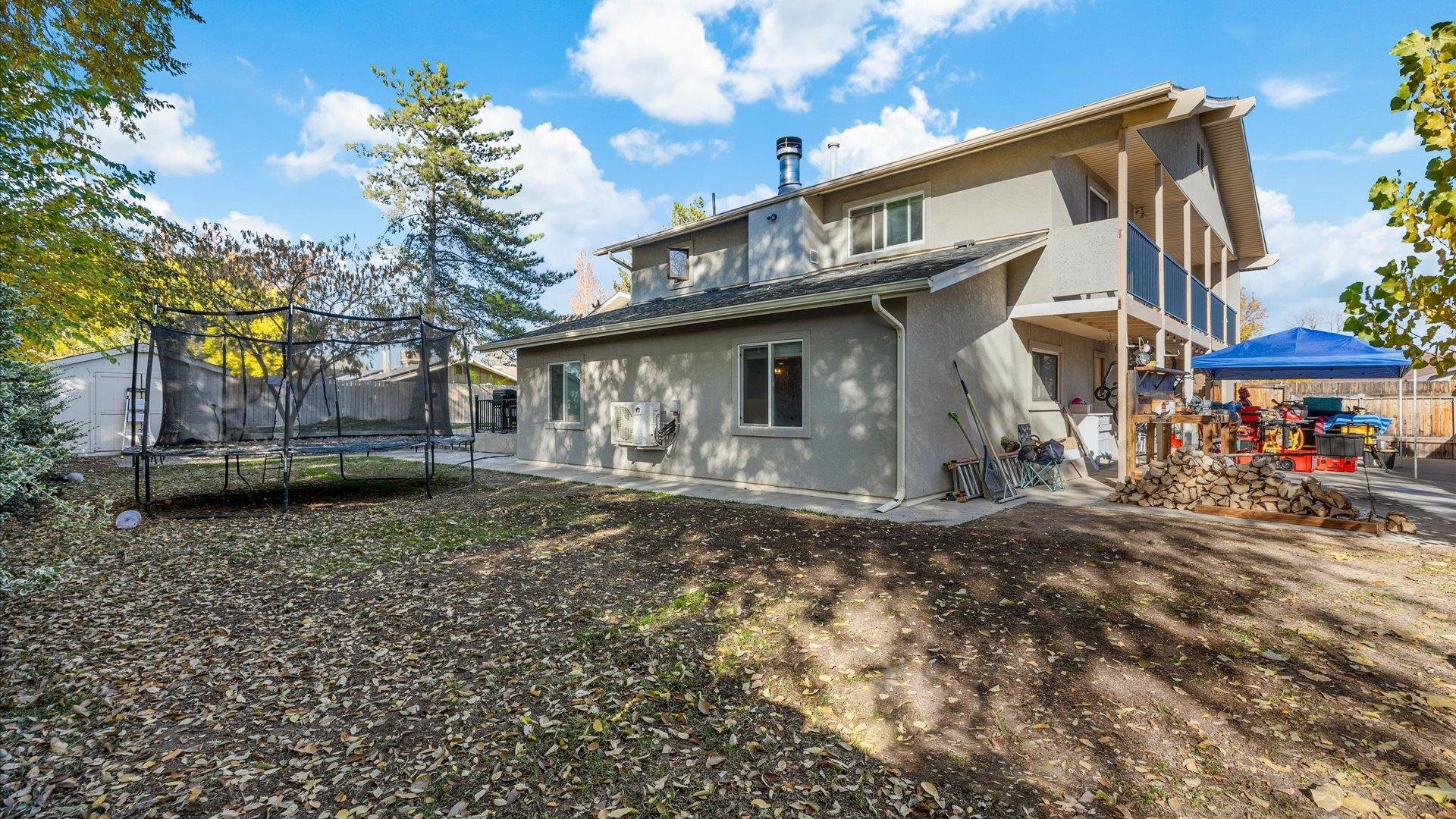 357 Music Lane Grand Junction, CO 81506 - Photo 29 of 29 a view of a house with a yard and sitting area
