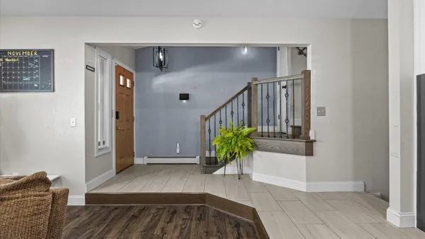 a view of entryway with wooden floor