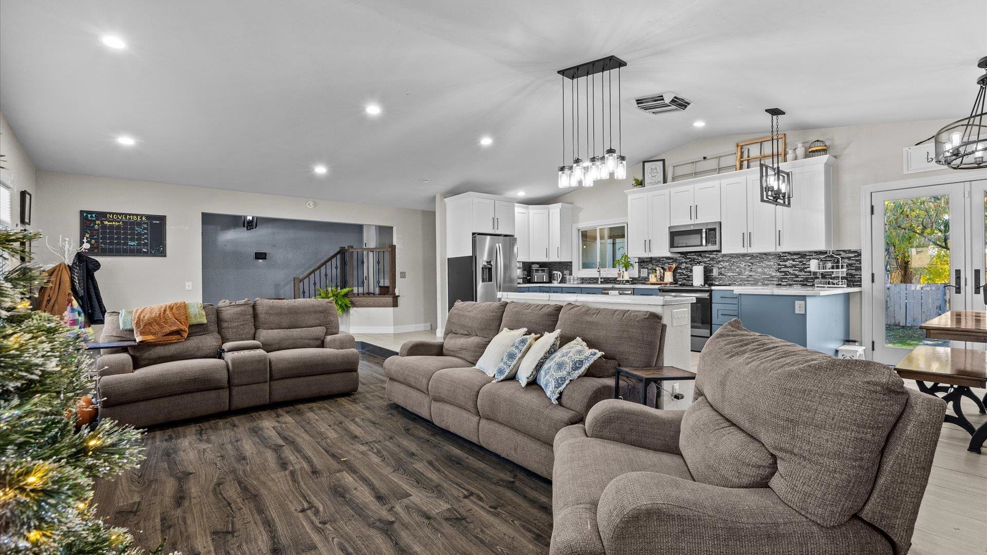 357 Music Lane Grand Junction, CO 81506 - Photo 6 of 29 a living room with furniture and a view of kitchen