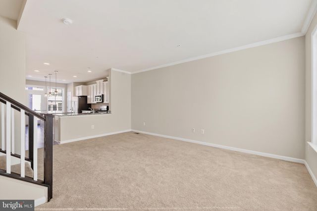 a view of kitchen and wooden floor