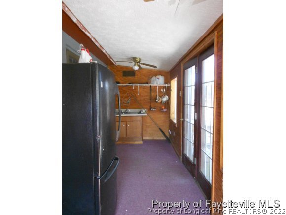 4788 Cameron Road Hope Mills, NC 28348 - Photo 15 of 17 a view of a hallway with a bathroom