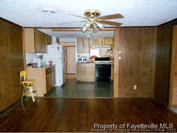 4788 Cameron Road Hope Mills, NC 28348 - Photo 5 of 17 a view of a dining room with furniture and wooden floor
