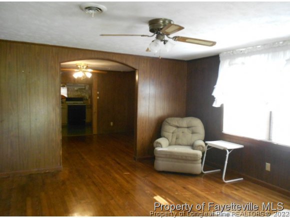 4788 Cameron Road Hope Mills, NC 28348 - Photo 6 of 17 a living room with furniture and a lamp