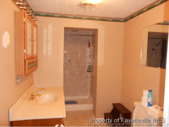 4788 Cameron Road Hope Mills, NC 28348 - Photo 8 of 17 a bathroom with a shower and a sink