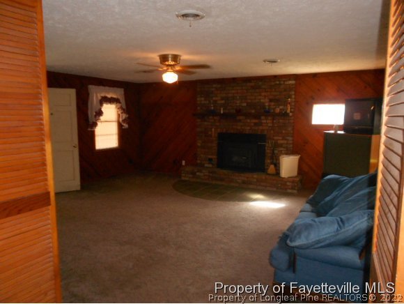 4788 Cameron Road Hope Mills, NC 28348 - Photo 9 of 17 a view of a livingroom with furniture and chandelier fan