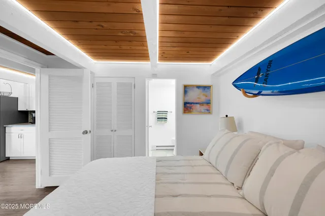 a bed room with a bed and a large window