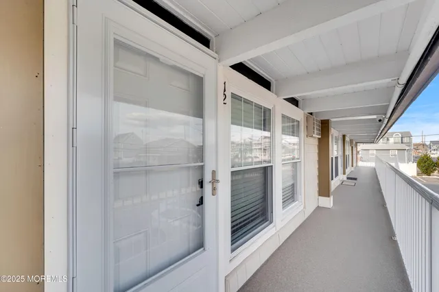 a view of a hallway with an entryway