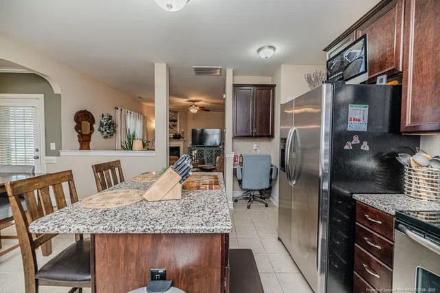 a kitchen with refrigerator and countertop