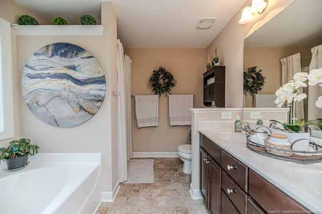 a bath room with a sink and a mirror