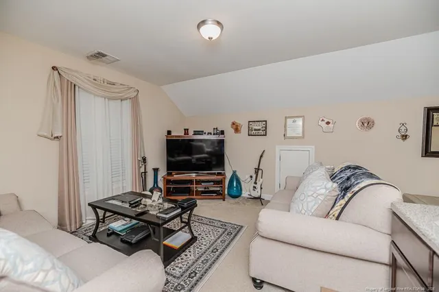 a living room with furniture and a couch