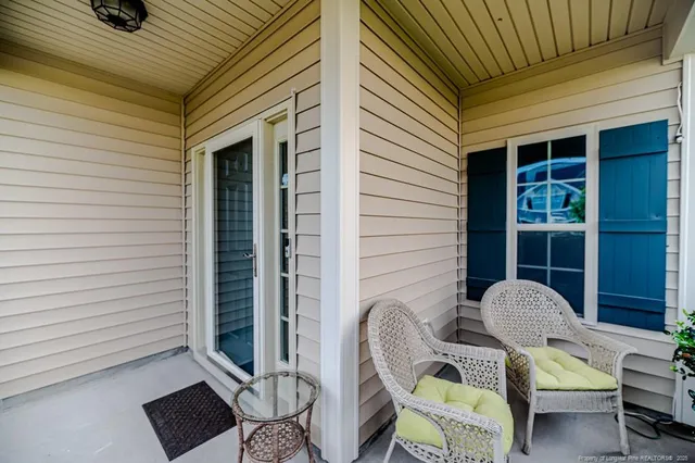a view of a patio with a chairs and table in a patio