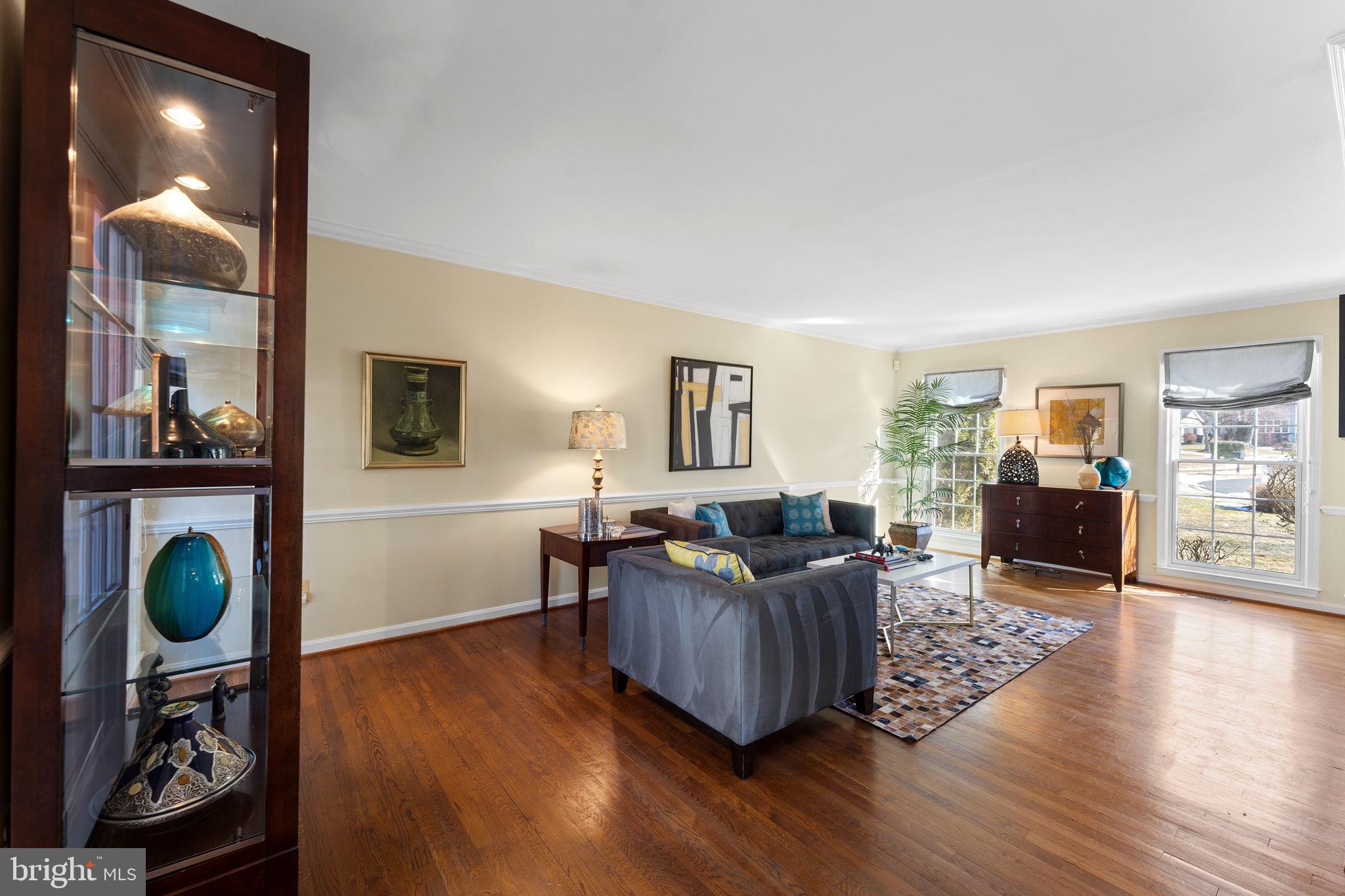 6140 Ramshorn Drive McLean, VA 22101 - Photo 15 of 72 a living room with fireplace furniture and wooden floor