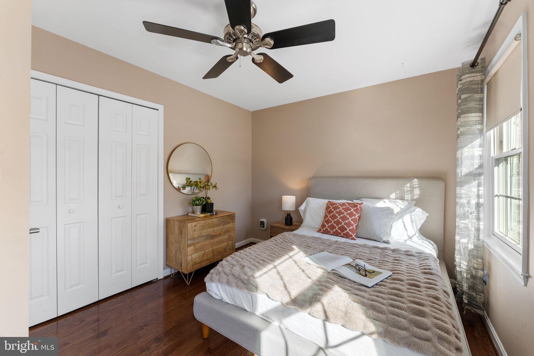 6140 Ramshorn Drive McLean, VA 22101 - Photo 23 of 72 a bedroom with a bed and a chandelier