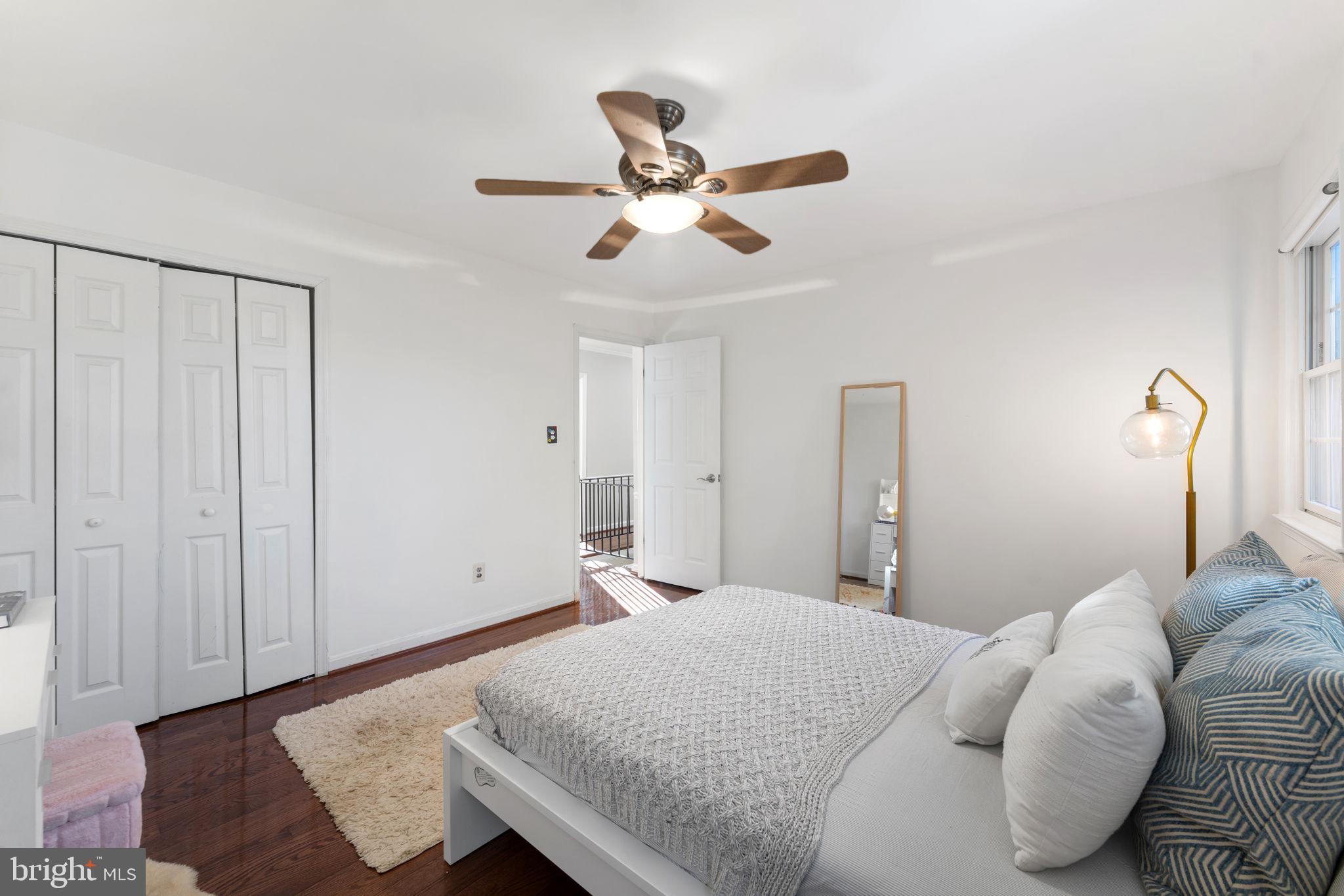 6140 Ramshorn Drive McLean, VA 22101 - Photo 26 of 72 a bedroom with a bed and a chandelier